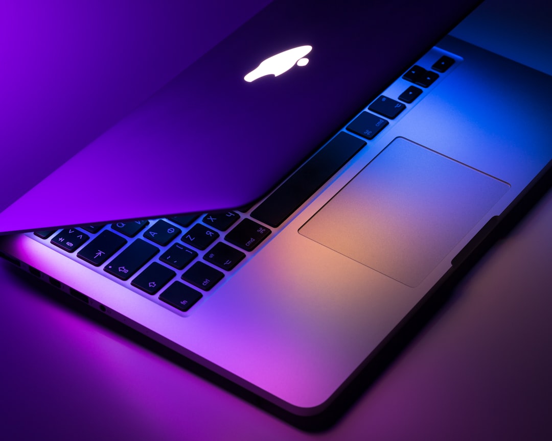 MacBook user reviewing online privacy settings and security features on macOS