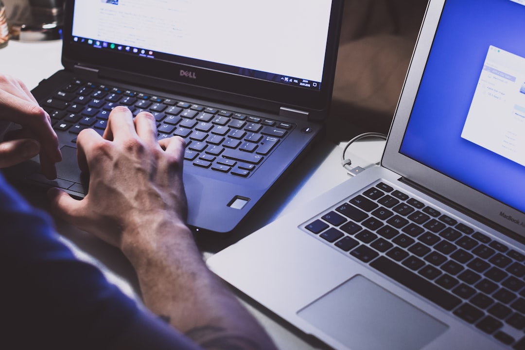 Person comparing VPN options on laptop with security icons displayed on screen